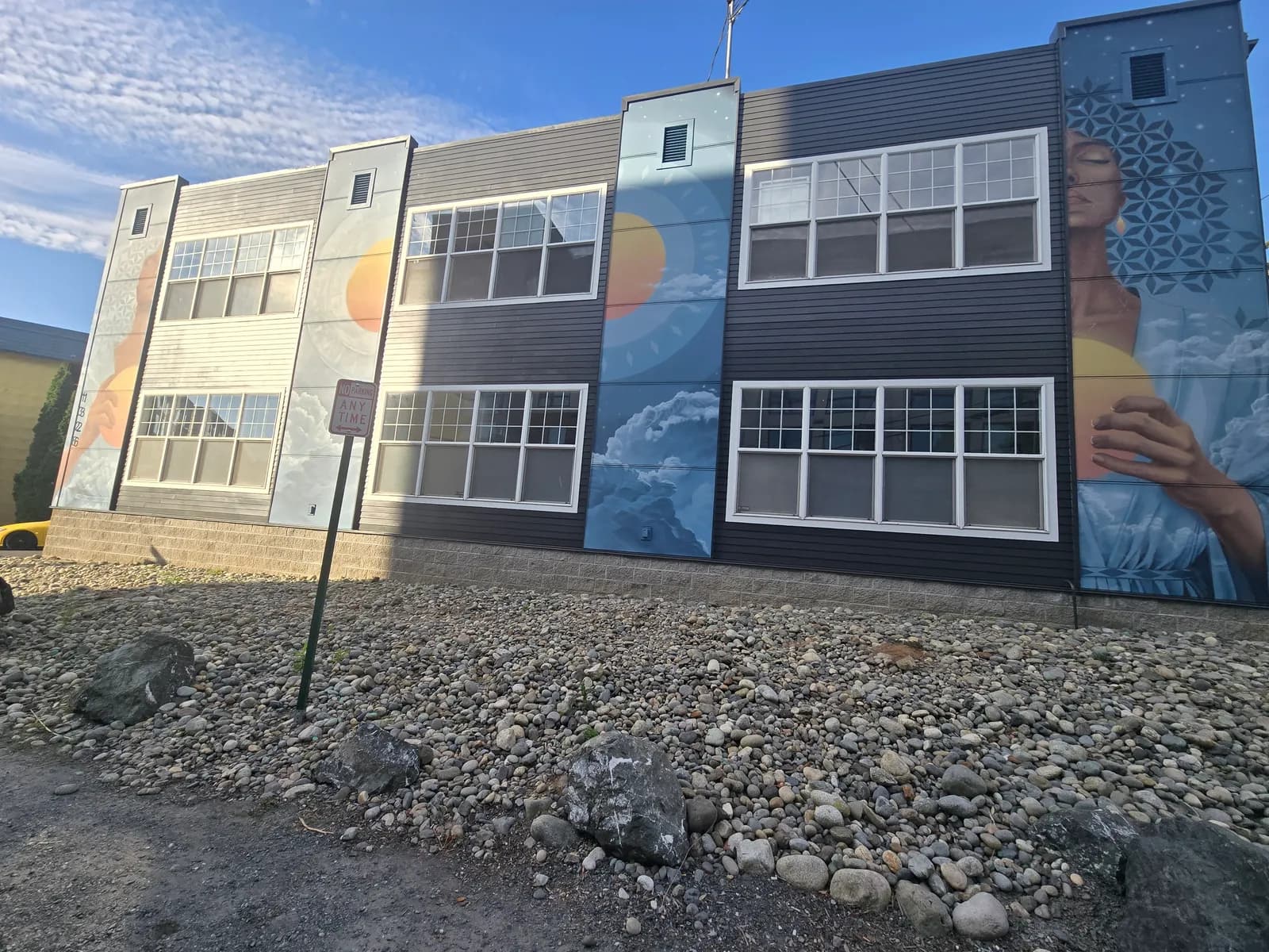 Murals painted across the exterior of the Clarity Tax & CPAs building in Bellingham, WA