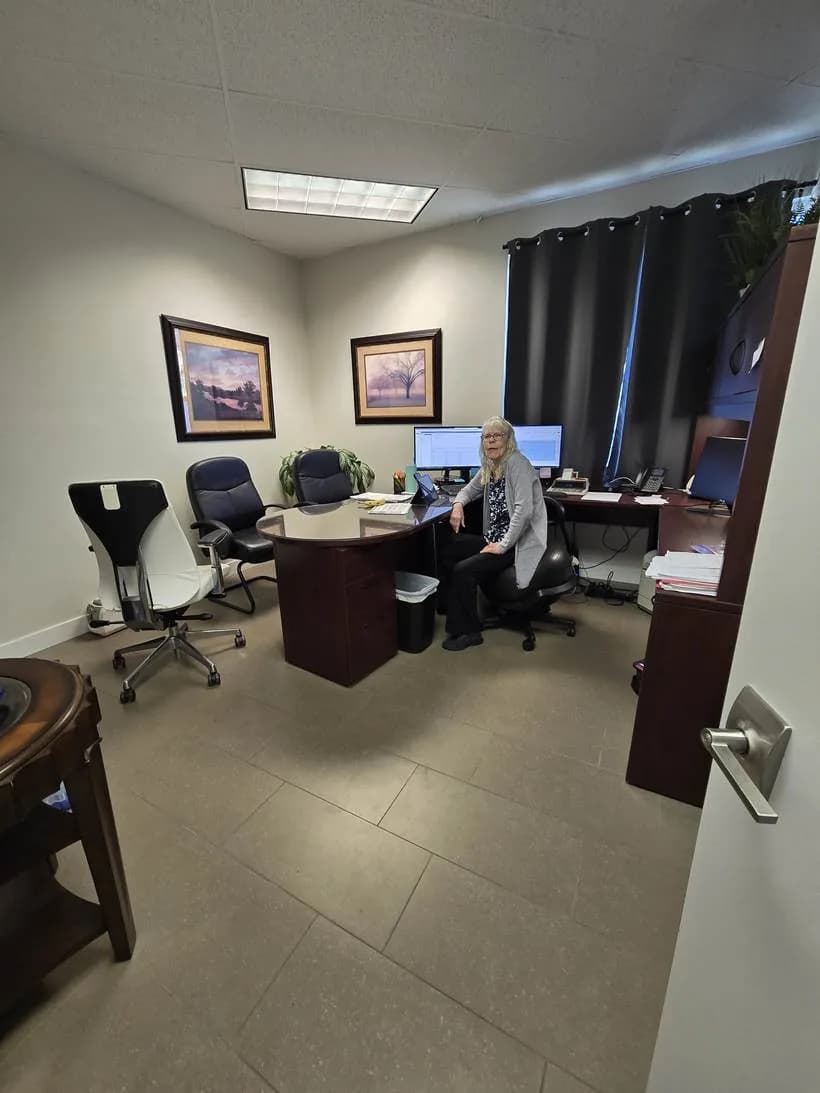 A Clarity Tax and CPAs bookkeeper working at her desk inside the Bellingham office
