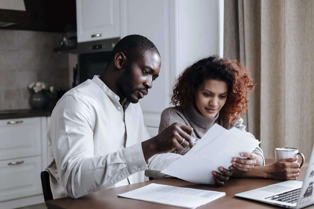 Individual reviewing tax paperwork at home — personal income tax return preparation